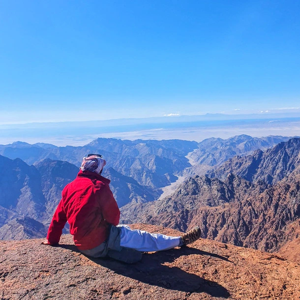 A Bedouin guide hiking up Mount Bab El-Donya, one of the three key peaks during a Sinai trekking route