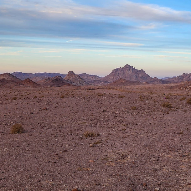 A natural landscape view of Wadi El-Ferie before sunset with golden light and no hikers, captured during Sinai trekking