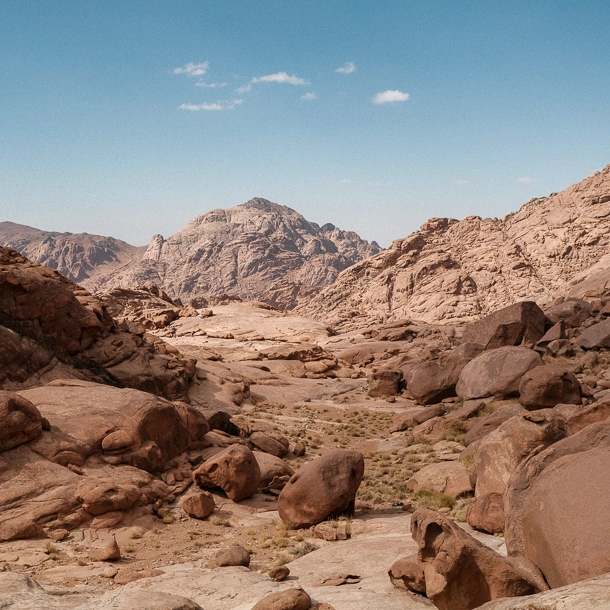 Hiking in Egypt Mountains with a scenic view along the trail to the summit of Mount Ahmar, with rugged terrain and sweeping mountain landscapes—an unforgettable part of Hiking Egypt.