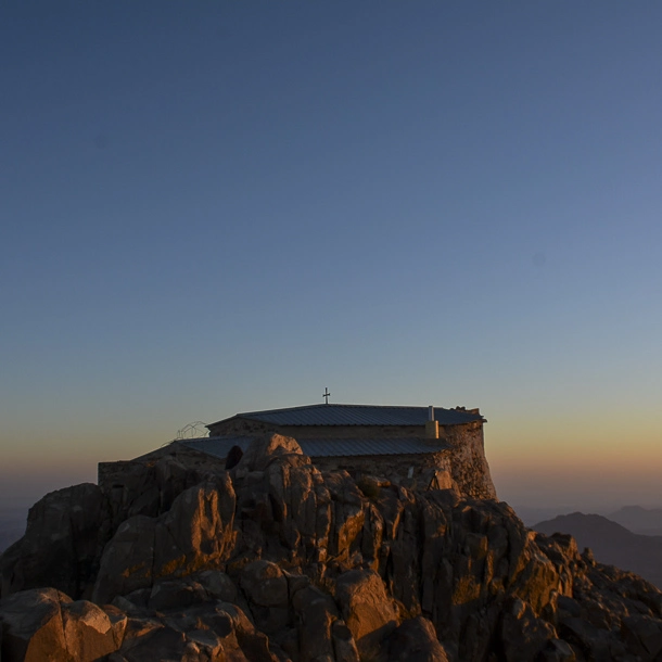 Morning sunlight illuminating Mount Catherine’s rocky summit, captured during a high-altitude hike in Egypt.