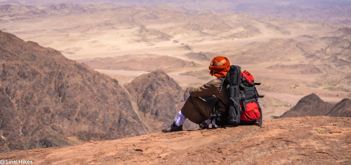 A Bedouin guide enjoying the panoramic view from the summit of Mount Na’ga in South Sinai.