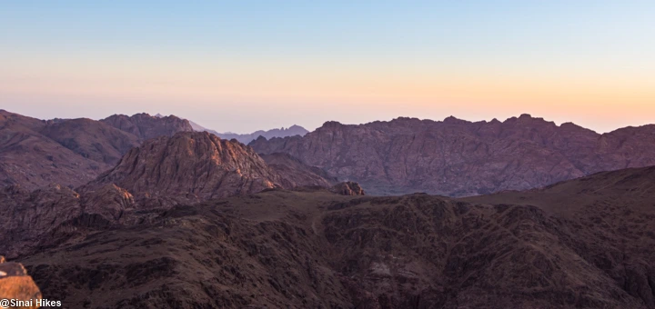Sunset view from Mount Abbas Basha overlooking the rugged Sinai Mountains landscape.