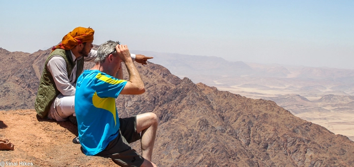 Bedouin guide and hiker at the summit of Mount Bab El-Donya in the Sinai Mountains.